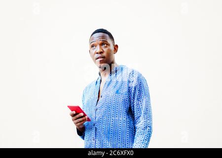 young black man with his smartphone in hand Stock Photo