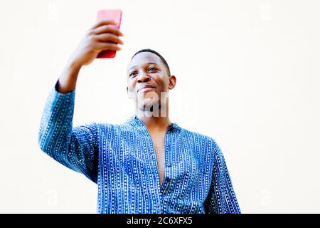 young african man making a selfie with his smartphone Stock Photo