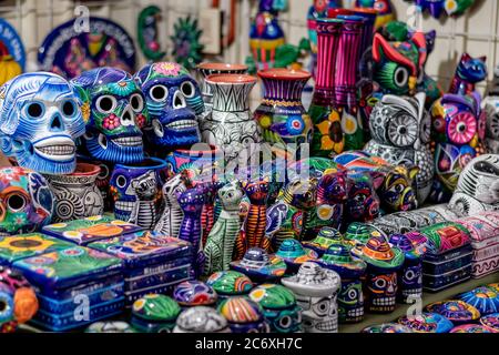 Colorful ceramic skulls for sale at market in Morelia Mexico Stock Photo