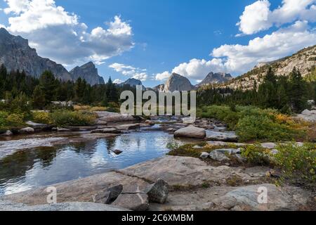 The East Fork River in the Wind River Range of Wyoming. Left to right, Ambush Peak, Raid Peak and Midsummer Dome are seen to the north. Stock Photo