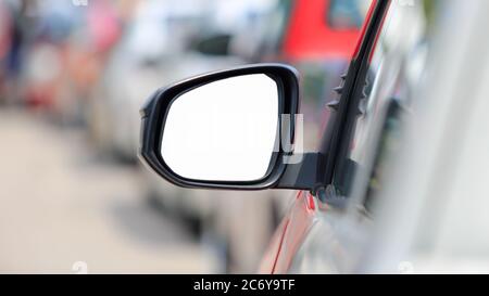 white background , side view mirror car in rush hour traffic Stock Photo