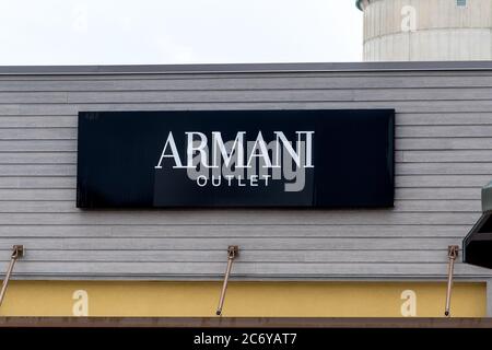 Giorgio Armani retail outlet in Calle Larga XXII Marzo, San Marco, Venice,  Veneto, Italy illuminated at night with signage with colorful window displa  Stock Photo - Alamy