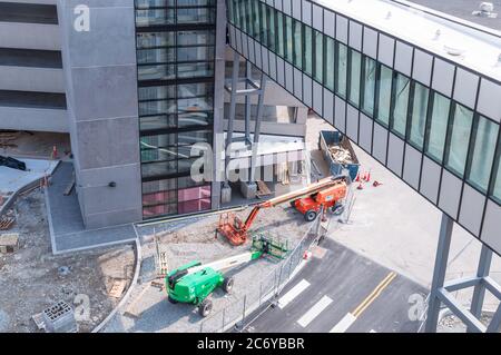 A construction site under an elevated walkway into a parking garage being built in the Bakery Square complex, Pittsburgh, Pennsylvania, USA Stock Photo