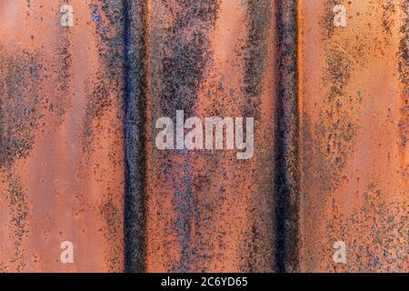 Texture of fluted rusty metal plate. Corrugated. Stock Photo