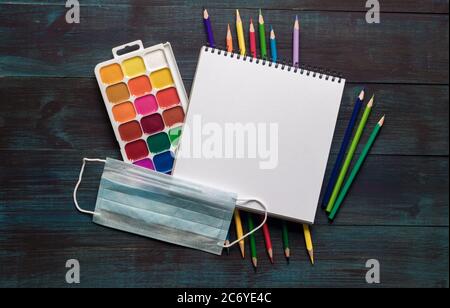 School supplies center composition on blue wooden background Stock Photo