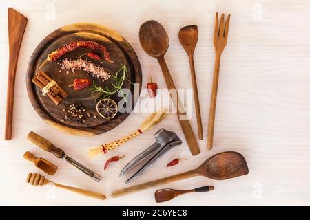 Kitchen utensils on a wooden background. Various kitchen utensils on wooden table. Chef tools. Home cooking. Stock Photo