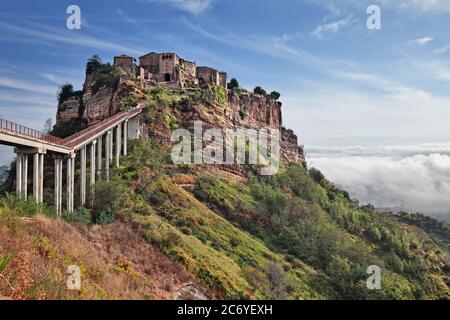 Civita di Bagnoregio, Viterbo, Lazio, Italy: landscape at sunrise of the ancient village founded in Etruscan time on the steep tuff hill Stock Photo