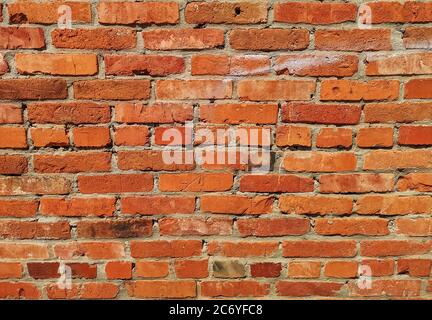 Weathered stained old red brick wall texture Stock Photo