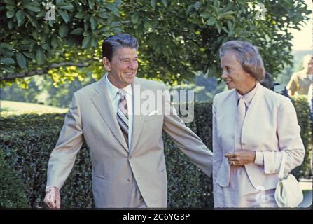 United States President Ronald Reagan, left, escorts his nominee as Associate Justice of the Supreme Court to replace Potter Stewart who retired, Judge Sandra Day O'Connor, right, of the Arizona Court of Appeals, to pose for photographers in the Rose Garden of the White House in Washington, DC on July 15, 1981.  Judge O'Connor is in Washington to muster support for her confirmation. Credit: Arnie Sachs / CNP / MediaPunch Stock Photo