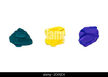 Multi-colored acrylic paint strokes on white background. Green, yellow, purple colors. Copy space. Stock Photo