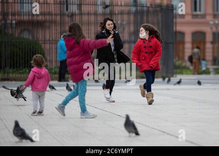 Buenos Aires, Argentina. 12th July, 2020. Children play at a square in Buenos Aries, Argentina, on July 12, 2020. Argentina's nationwide COVID-19 infections reached 100,166 after 2,657 new cases were reported in the previous 24 hours, the country's Ministry of Health said on Sunday. Credit: Martin Zabala/Xinhua/Alamy Live News Stock Photo