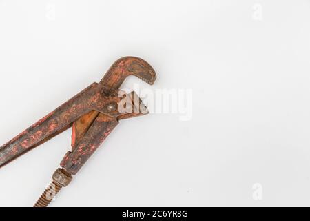 Old plumbing key isolated on white background. Home, adjusting. Stock Photo