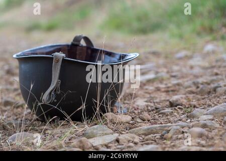 a US M1 helmet on the ground Stock Photo