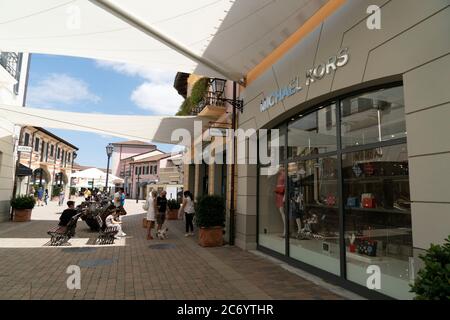 SERRAVALLE SCRIVIA, ITALY - JULY 12 2020 - Lot of people buying fashion items at the beginning of designer outlet Sale season wearing mask after covid Stock Photo