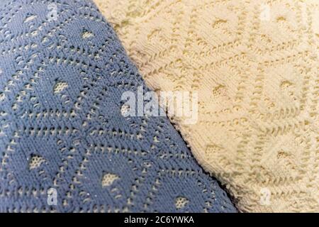 Two pullovers of different colors, knitted wool textures, winter background. Stock Photo