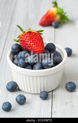 Mix of ripe berries on grey table, top view Stock Photo - Alamy