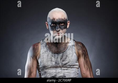 Image of bald dirty guy on gray background Stock Photo