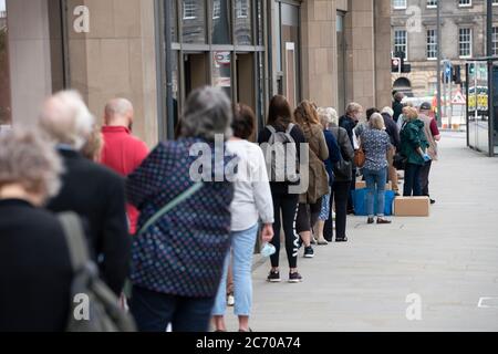 Edinburgh, Scotland, UK. 13 July, 2020, Monday in Scotland saw re-opening of shopping centres after further relaxation of coronavirus lockdown on business. John Lewis & Partners department store opened early at 9.30 am after a long queue had formed outside. Iain Masterton/Alamy Live News Stock Photo