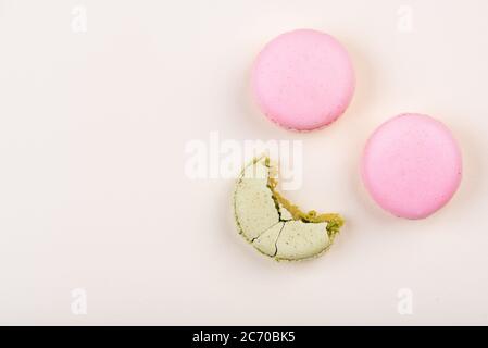 Macaroons on yellow background. Top view. Stock Photo