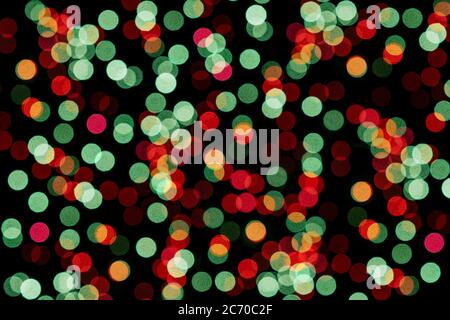 Blurredlights on a black background. Pink bokeh, festive concept. Stock Photo