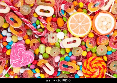 Colorful lollipops and different colored candies. Top view. Stock Photo