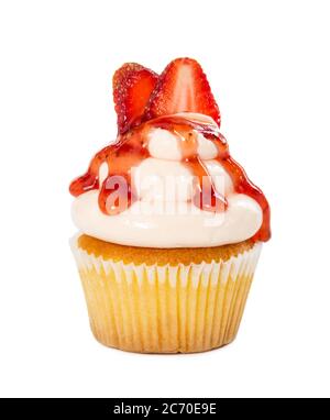 Cupcake with strawberry syrup and fresh strawberries isolated on white background. Stock Photo