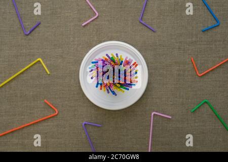 Top view on multi-colored disposable tubes. Environmental concept. Flat lay. Stock Photo