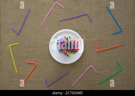 Top view on multi-colored disposable tubes. Environmental concept. Flat lay. Stock Photo
