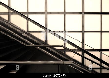 Tokyo scenery with stairs and escalator in a bright building with outside light Stock Photo