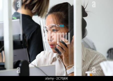 London, UK. 13th July 2020 The 'Oh My Nails' Salon in Twickenham, West London opens its doors for manicure and pedicure to customers for the first time since lockdown. The shop has installed measures, like screens and temperature testing to keep staff and clients safe. Andrew Fosker / Alamy Live News Stock Photo