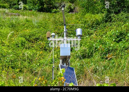 Mobile weather station with solar panel placed on a hill in wineries to monitor atmospheric conditions. Stock Photo