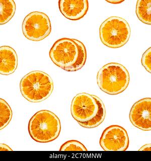 Seamless pattern with slices of dried orange isolated on white background. Stock Photo