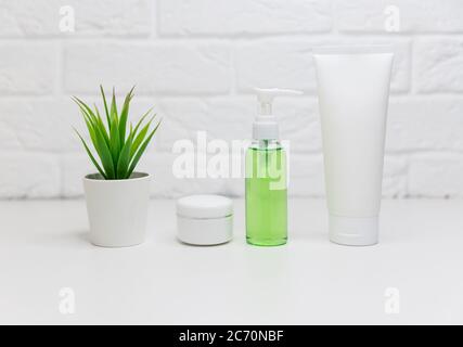 Different cosmetic products for skincare Cosmetic containers with aloe Stock Photo