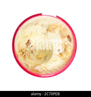 Open plastic box of vanilla ice cream with nuts and caramel isolated on white background Stock Photo