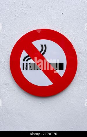 No Smoking Sign on a Concrete Wall Stock Photo