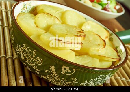 Scalloped Potato And Smoked Fish Pot, Smoked haddock and potato gratin Stock Photo