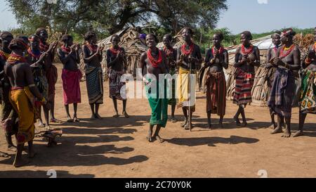 Omorate, Ethiopia - September 2017: Unidentified women from Dassanech tribe singing and dancing in their village near the Omorate river, Ethiopia Stock Photo