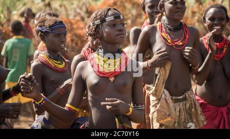 Omorate, Ethiopia - September 2017: Unidentified women from Dassanech tribe singing and dancing in their village near the Omorate river, Ethiopia Stock Photo