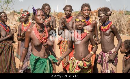 Omorate, Ethiopia - September 2017: Unidentified women from Dassanech tribe singing and dancing in their village near the Omorate river, Ethiopia Stock Photo