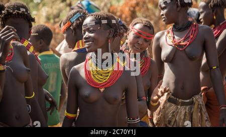 Omorate, Ethiopia - September 2017: Unidentified women from Dassanech tribe singing and dancing in their village near the Omorate river, Ethiopia Stock Photo