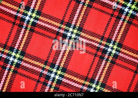 Red Scottish tartan plaid fabric material pattern background Stock Photo