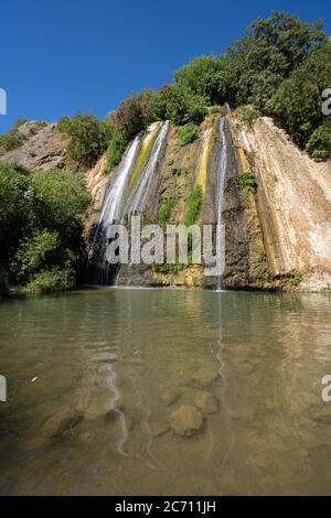 Israel, Upper Galilee, Iyyon River (Nahal Ayun or Ayun Stream) Nature reserve. The Mill waterfall (Hatahana) and chalk cliffs. Photographed in June Stock Photo