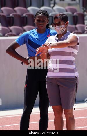 Southern California Trojans coach Caryl Smith Gilbert (right) assists ...