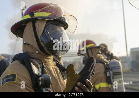 San Diego, United States. 13th July, 2020. U.S. Navy Sailors prepare to combat a fire aboard the USS Bonhomme Richard (LHD 6) on July 12, 2020. On the morning of July 12, a fire was called away aboard the ship while it was moored pier side at Naval Base San Diego. Base and shipboard firefighters responded to the fire. USS Bonhomme Richard is going through a maintenance availability, which began in 2018. Photo by MC3 Christina Ross/U.S. Navy/UPI Credit: UPI/Alamy Live News Stock Photo