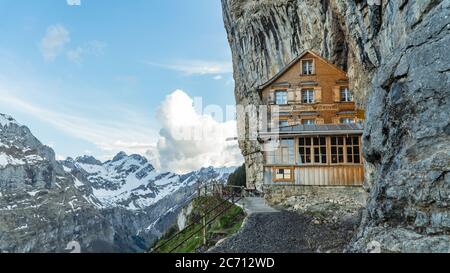 EBENALP, SWITZERLAND, May 2017: Ebenalp with its famous cliff inn Aescher. Ebenalp is an attractive recreation region for hiking, climbing, skiing and Stock Photo