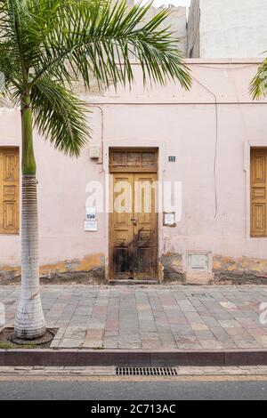 Abandoned derelict house with dirty pink facade in Los Cristianos, Tenerife, Canary Islands, Spain Stock Photo