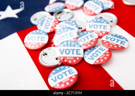 Patriotic pile of button pins on US flag background Stock Photo