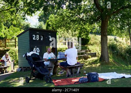 Abinger Hammer Cricket Club play Worplesdon & Burpham cricket club, Surrey. Stock Photo