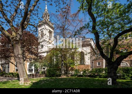 View of south elevation of the church from Whittington Garden, looking north west through the trees. Christopher Wren churches -  St. Michael Paternos Stock Photo