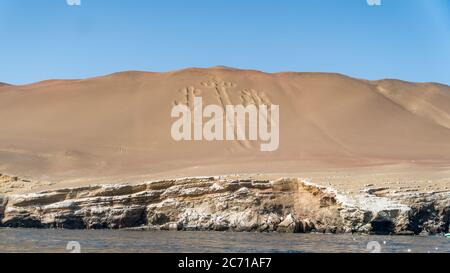 Paracas, Peru - September 2017: Ancient large scale candelabrum figure in Paracas national park Stock Photo